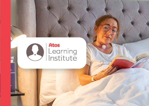 atos learning institute event banner, woman living with laryngectomy reading in bed